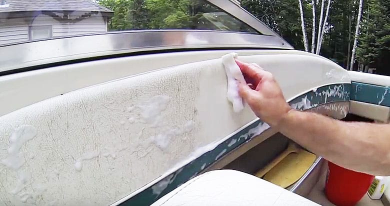 What is the most effective method for cleaning a boat cover made of canvas?