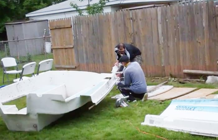 cutting up a fiberglass boat